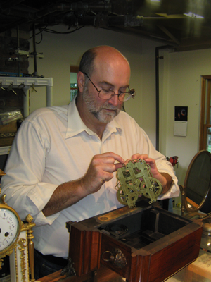 Jack repairing an antique clock