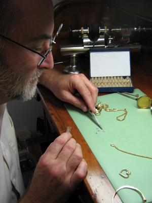 Jack repairing a necklace.
